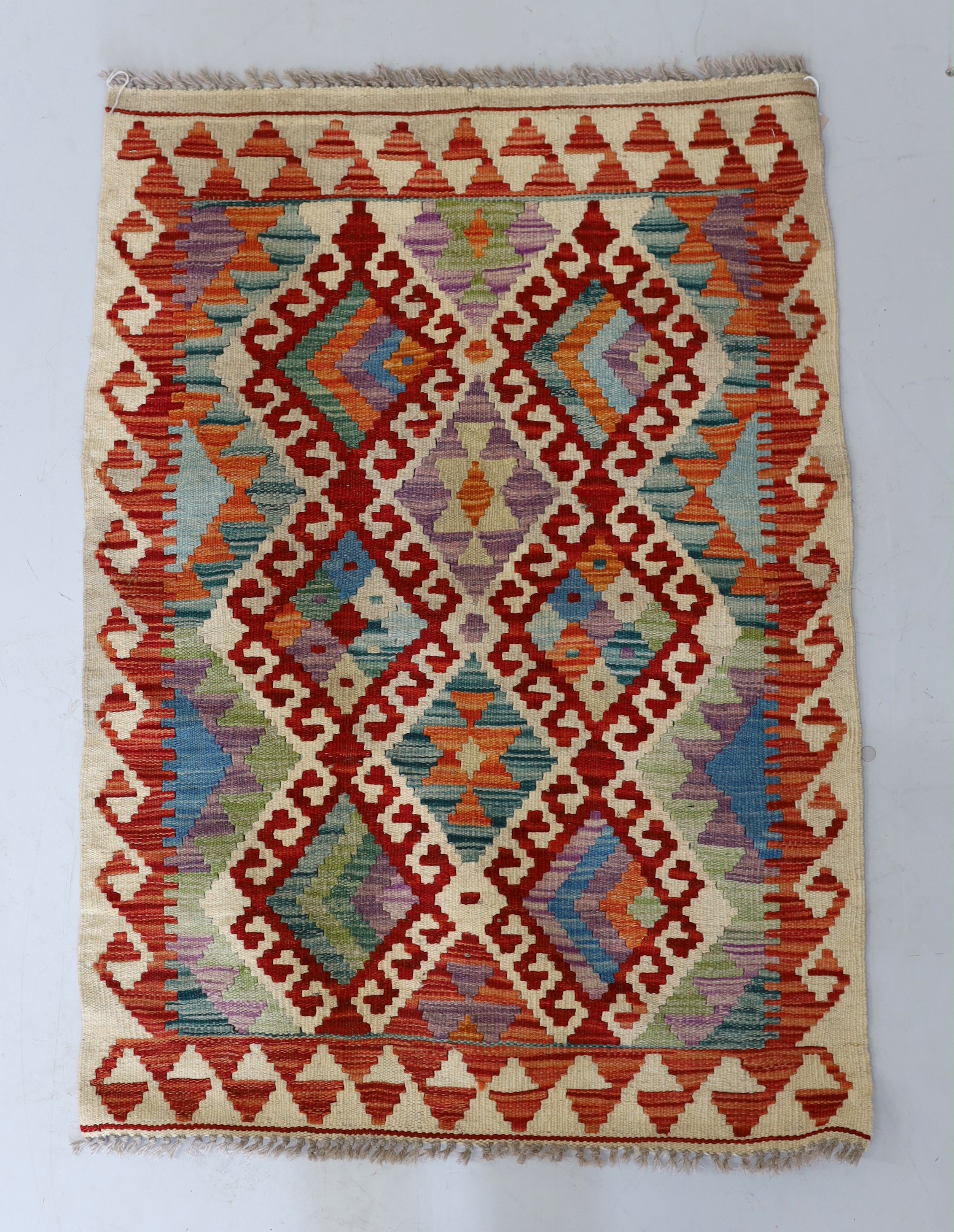 An Anatolian Kilim polychrome rug, 100 x 78cm